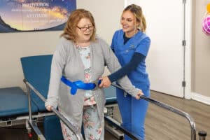 Rehab therapist and a resident at La Mesa facility