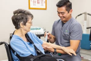 a caregiver and resident at La Mesa facility