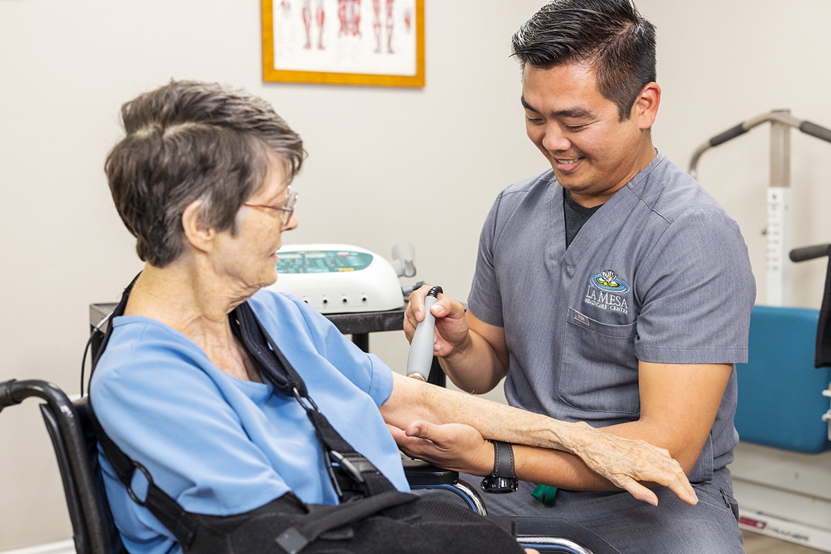 a caregiver and resident at La Mesa facility