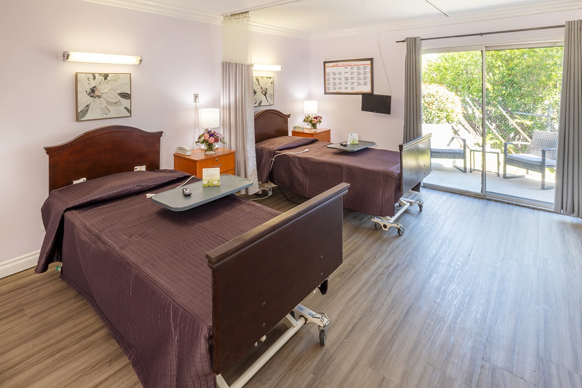 a semi-private room at La Mesa facility