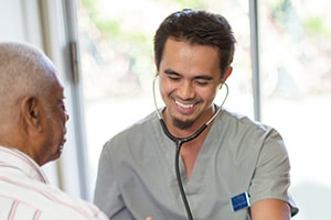 a caregiver and resident at La Mesa facility